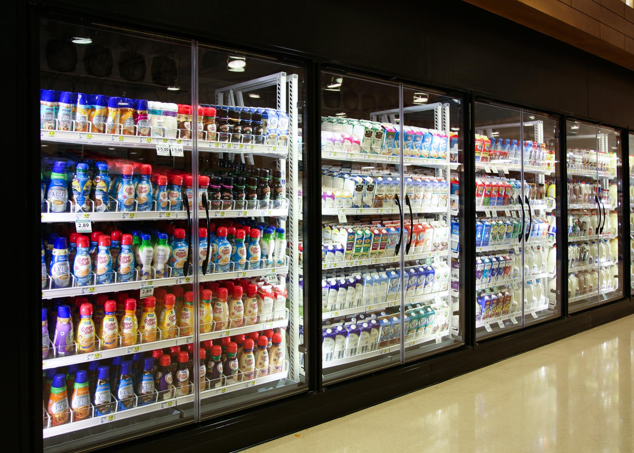 Milk Moover Shelving with Various Milk Cartons, Bottles, and Jugs