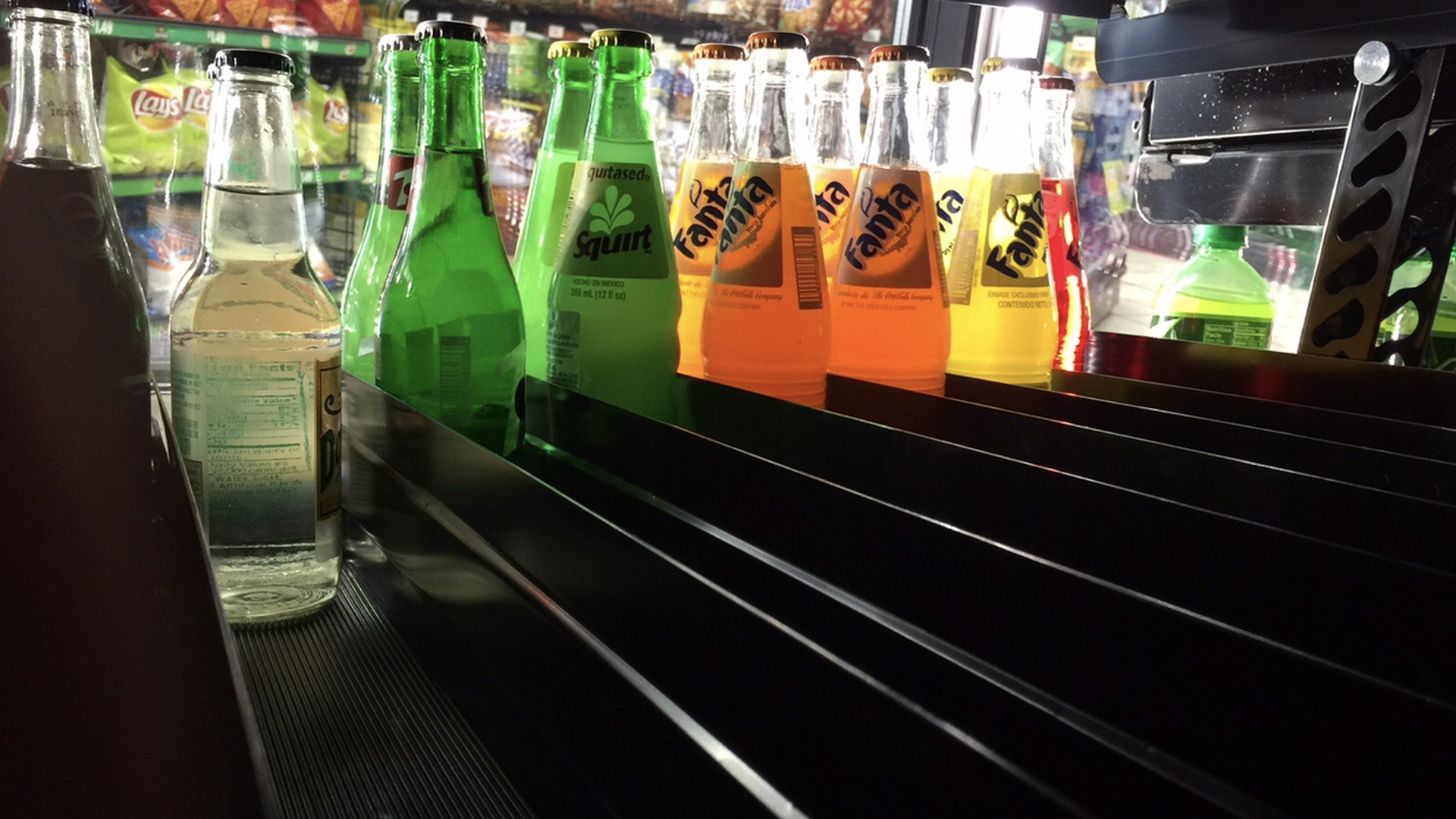 VersaSlide Shelving with Glass Soda Bottles