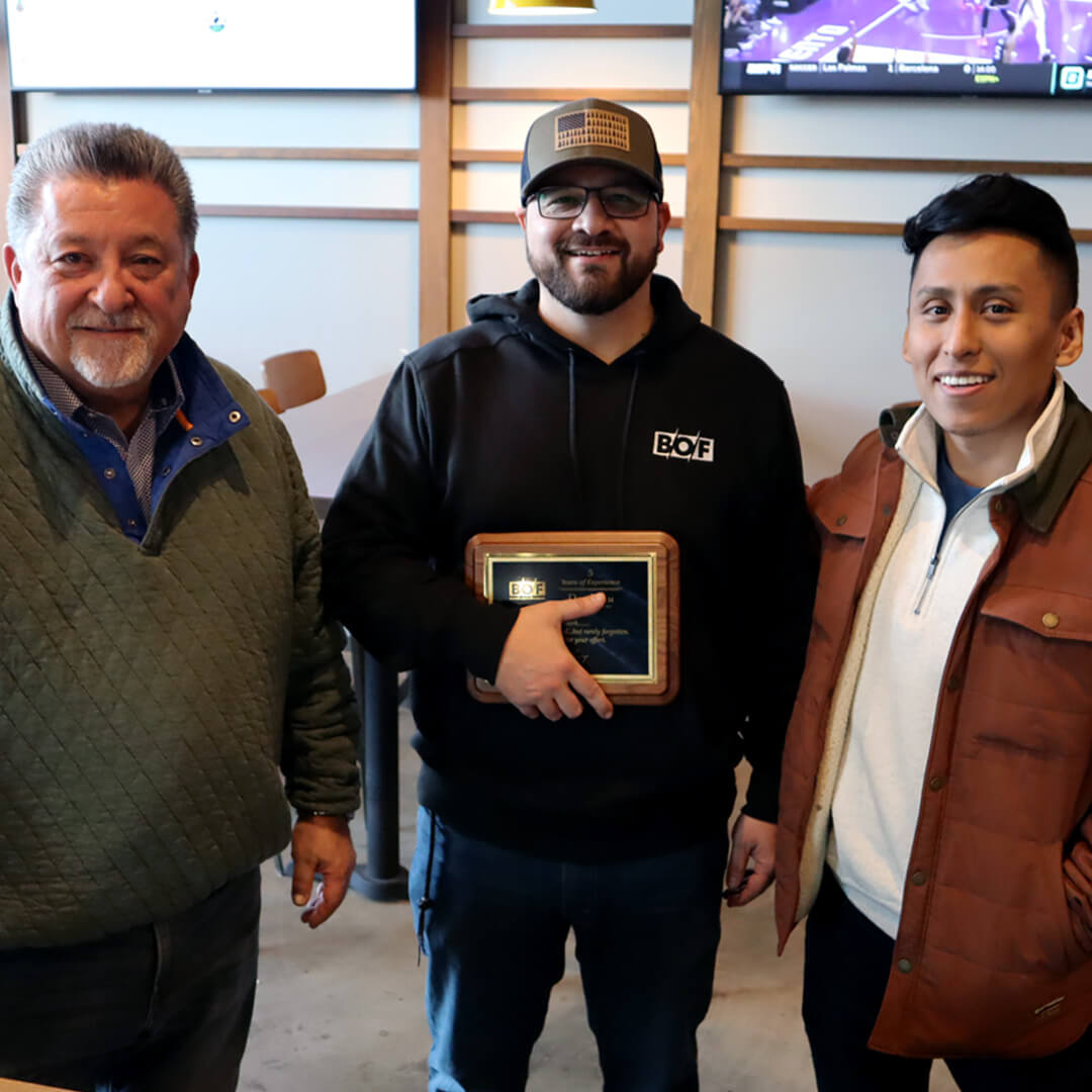 BOF's 2024 trip to Whirlyball. BOF staff members holding an award.