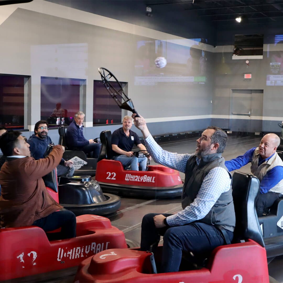 BOF's 2024 trip to Whirlyball. BOF staff members using bumper cars.