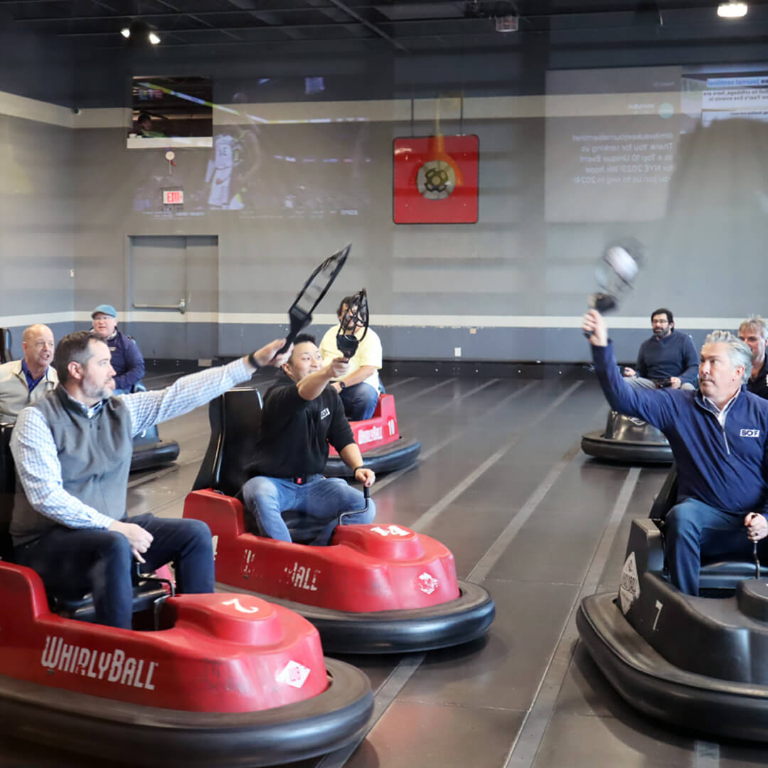 BOF's 2024 trip to Whirlyball. BOF staff members using bumper cars.