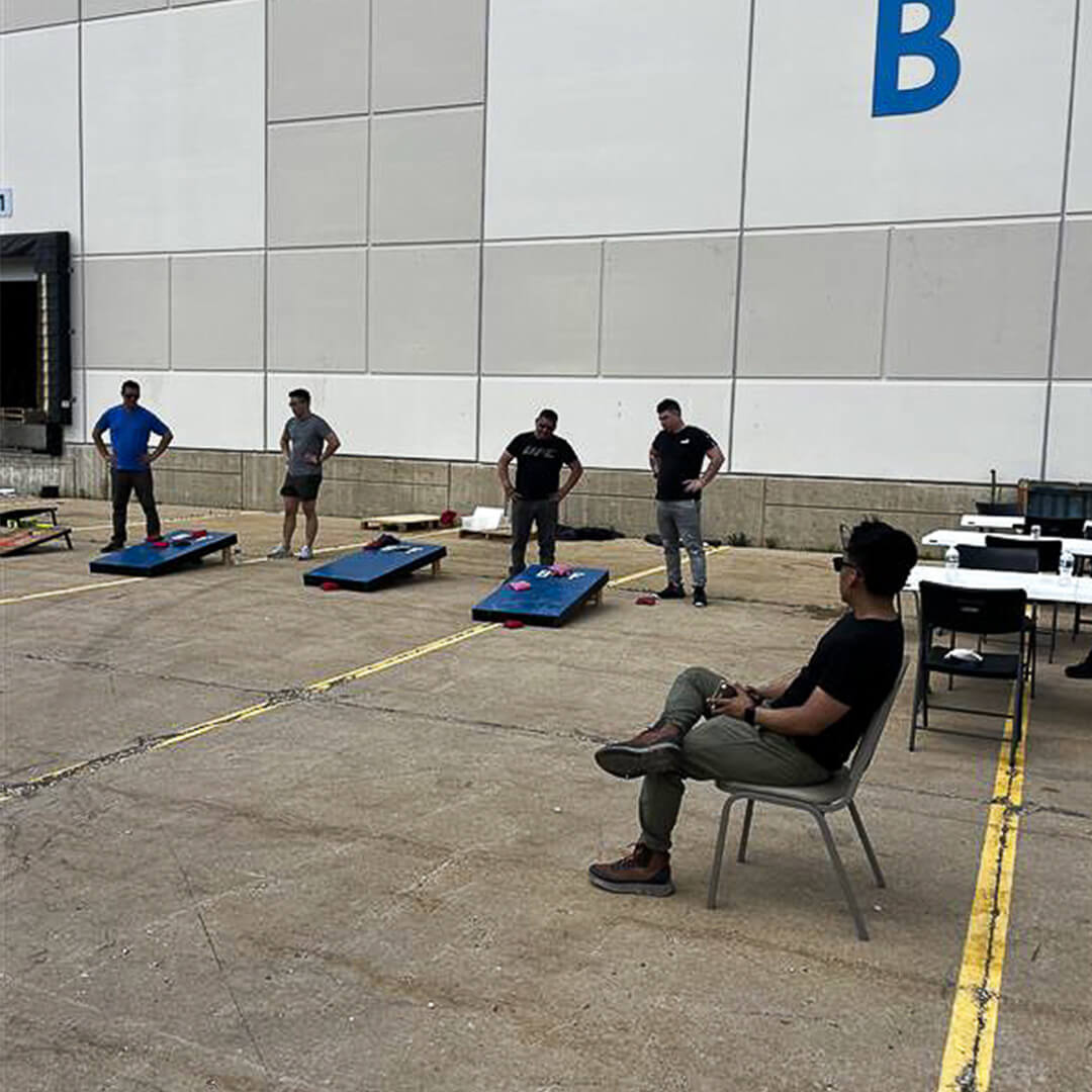 BOF employees playing bags at a company event