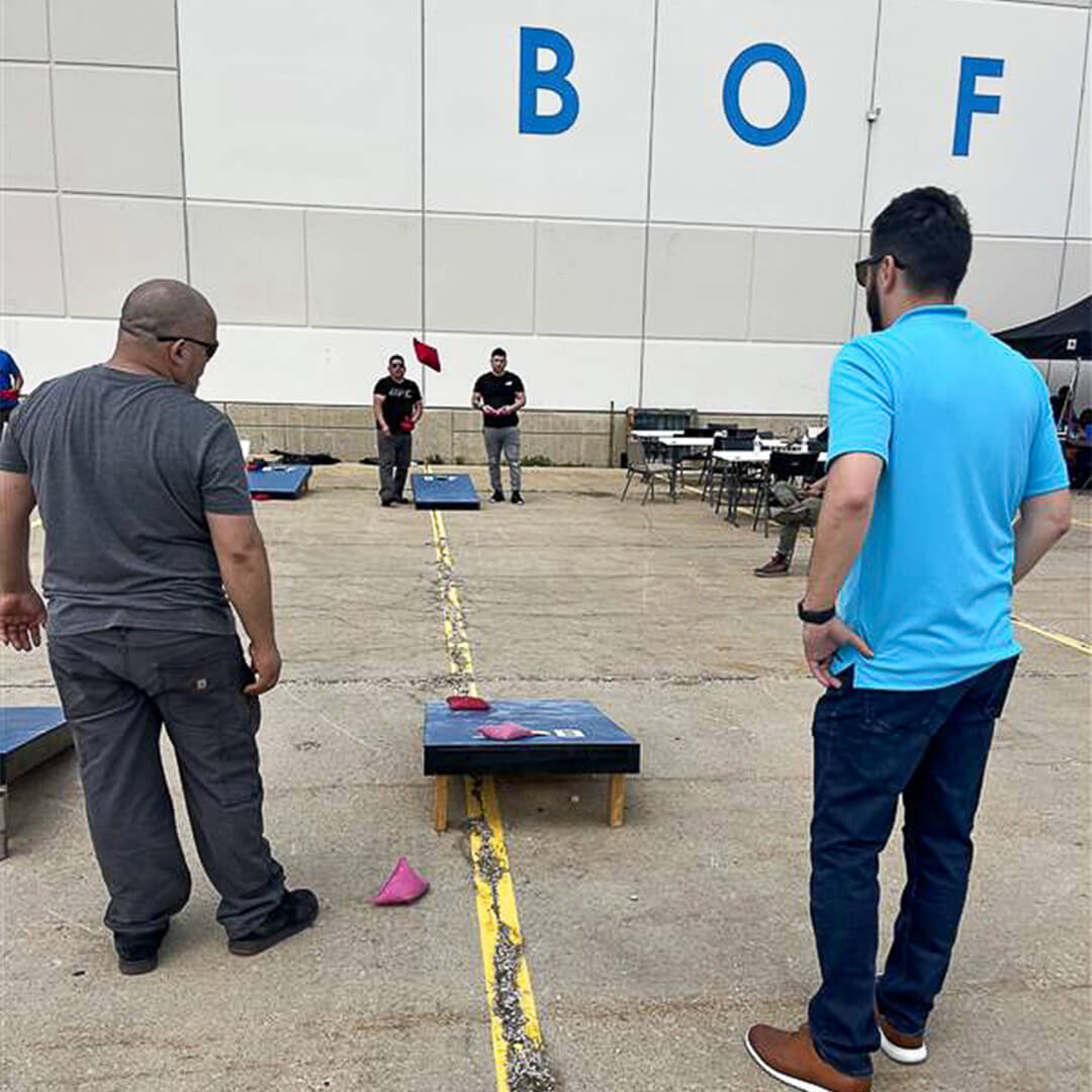 BOF employees playing bags at a company event